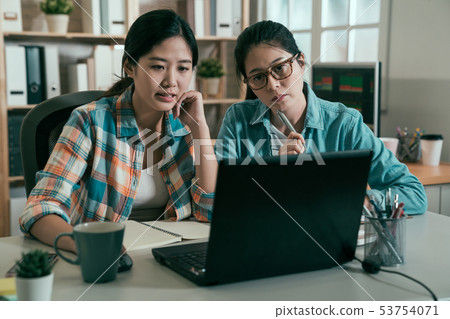 manager in meeting listening to female colleague manager in meeting listening to female colleague 53754071