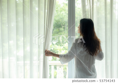 Lifestyle Women open window after get up 53754143