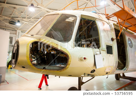 Mi-8 helicopter during maintencance and repair Mi-8 helicopter during maintencance and repair 53756595