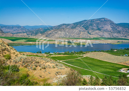 Okanagan valley panoramic view with residential area and orchard farm fields Okanagan valley panoramic view with residential area and orchard farm fields 53756832