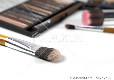 Close up makeup brushes with eye shadows palette 53757399
