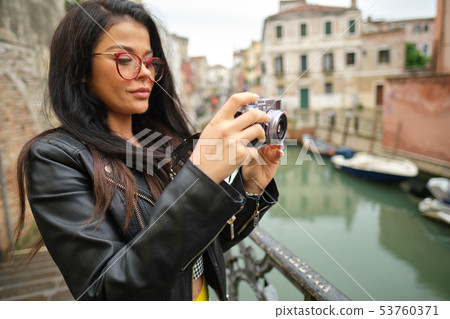 Travel photographer woman with camera in Venice, 53760371