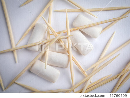 Toothpicks and chewing gum on white background Toothpicks and chewing gum on white background 53760509