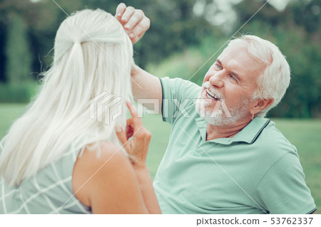 Cheerful happy man looking at his wife Cheerful happy man looking at his wife 53762337