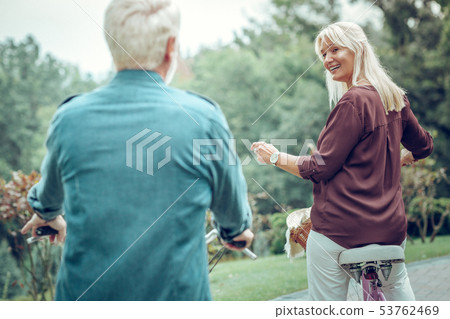 Joyful happy woman being faster than her husband 53762469
