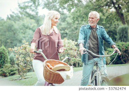 Nice senior couple having a pleasant conversation Nice senior couple having a pleasant conversation 53762474