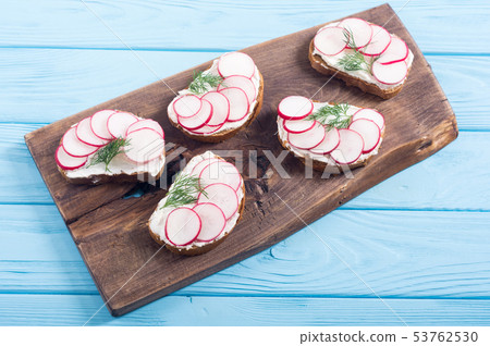 Healthy vegetable toasts sandwith with radish and 53762530