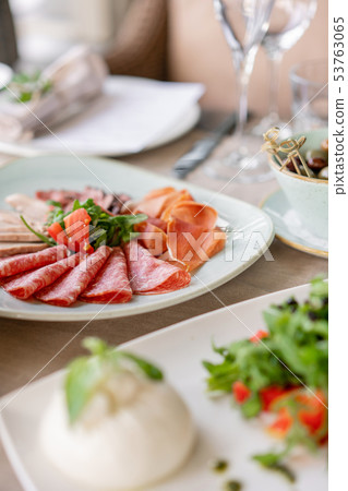 Gala dinner, serving table for birthday or wedding. Different meals for the guests on Banquet 53763065