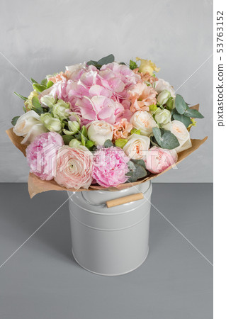 delicate, pastel coloured Small Beautiful bouquet of mixed flowers. Floral shop concept . Beautiful delicate, pastel coloured Small Beautiful bouquet of mixed flowers. Floral shop concept . Beautiful 53763152