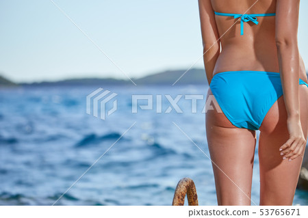 Sexy Woman Back On Sea Background 53765671
