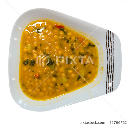 Garbanzo bean soup on a white plate 53766762