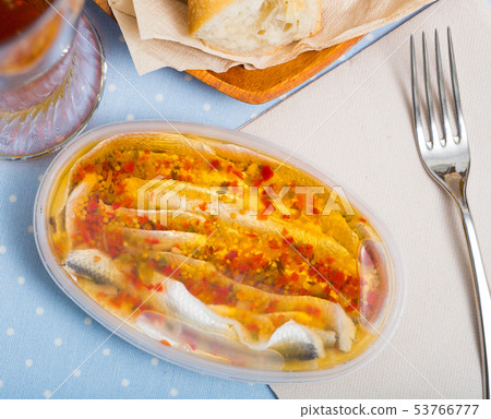 Herring preserves in a plastic jar Herring preserves in a plastic jar 53766777