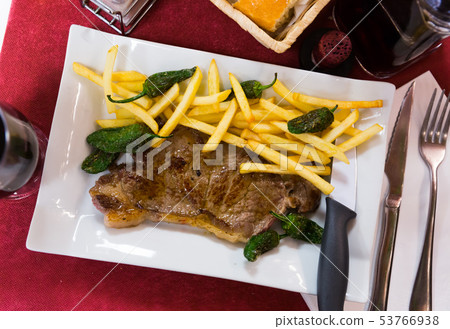 Beef steak with vegetable garnish Beef steak with vegetable garnish 53766938