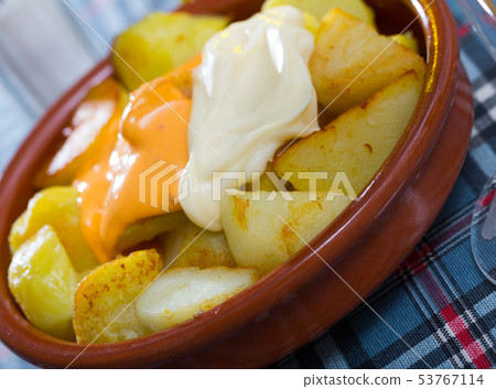 Patatas bravas with garlic mayonnaise and sauce Patatas bravas with garlic mayonnaise and sauce 53767114