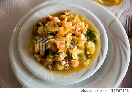 Delicious prawns, clams and calamari stewed with sauce and vegetables 53767338