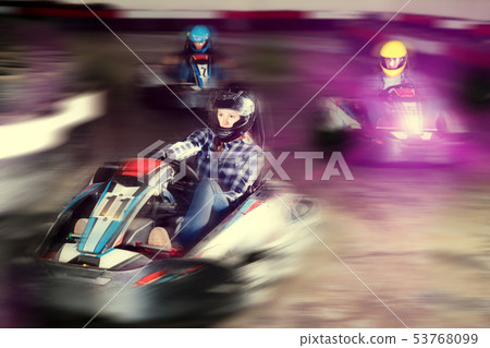 Young people driving sport cars for karting Young people driving sport cars for karting 53768099