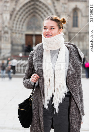 Cheerful young girl in scarf at the street Cheerful young girl in scarf at the street 53769018
