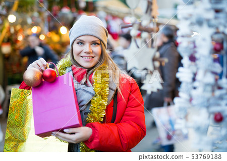 Happy woman on outdoor Christmas market Happy woman on outdoor Christmas market 53769188
