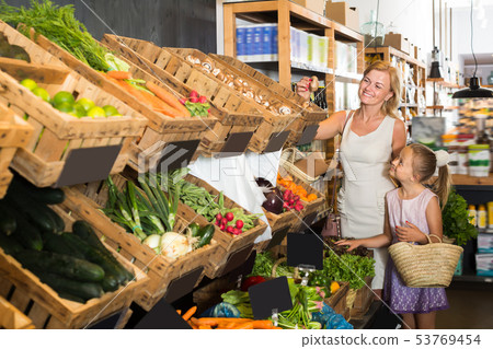 Portrait of glad young woman and girl shopping Portrait of glad young woman and girl shopping 53769454