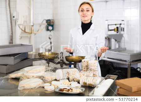 Portrait of female with packing of turron in food factory 53770214