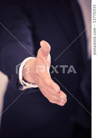 Successful businessman ready for handshake Successful businessman ready for handshake 53770335