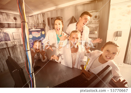 Happy family and kids is visiting of escape room 53770667