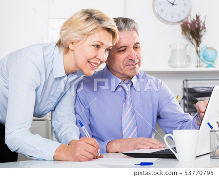 Secretary writes down tasks 53770795