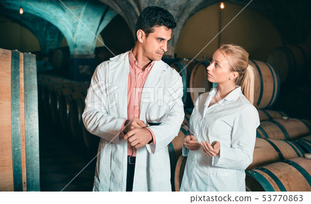 Specialists checking ageing process of wine Specialists checking ageing process of wine 53770863