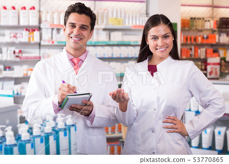 team of pharmaceutist and technician working in chemist shop team of pharmaceutist and technician working in chemist shop 53770865