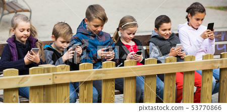 children with mobile devices children with mobile devices 53770866