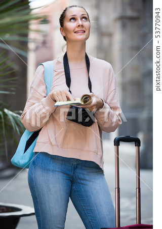 Young traveling girl searching for the direction 53770943