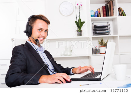Operator answering at call center 53771130