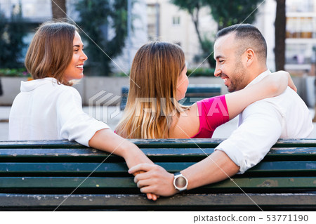Image of the love triangle between young people outdoor. 53771190