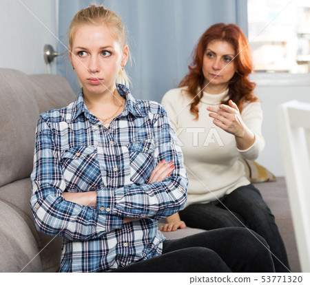 Mom points her daughter to her faults. 53771320