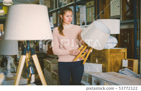 Female purchaser buying torchere Female purchaser buying torchere 53772122