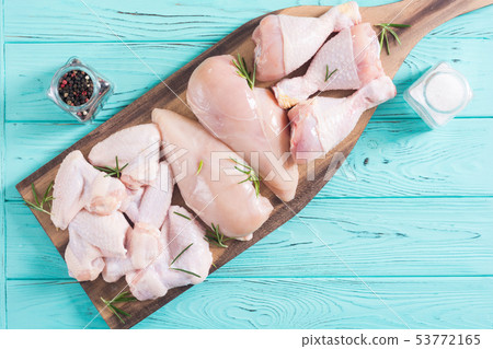 Raw chicken meat on wooden background Raw chicken meat on wooden background 53772165