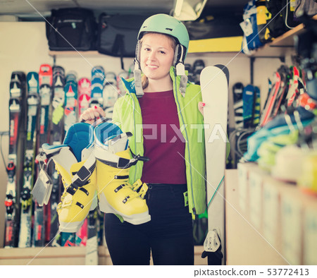 Portrait of client female in ski equipment who is demonstrating 53772413