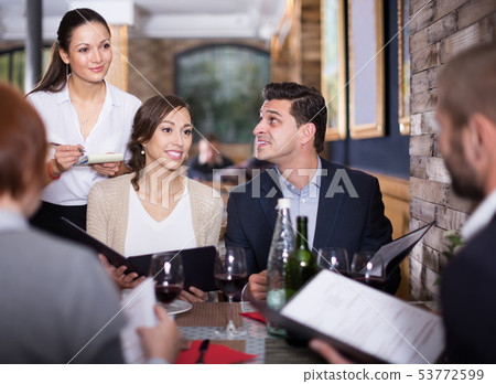 waitress female taking order from visitors waitress female taking order from visitors 53772599
