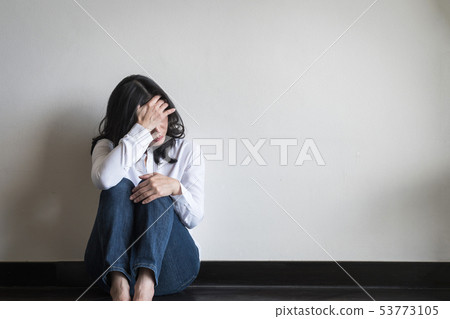 Stressful woman sitting sadly emotional depression 53773105