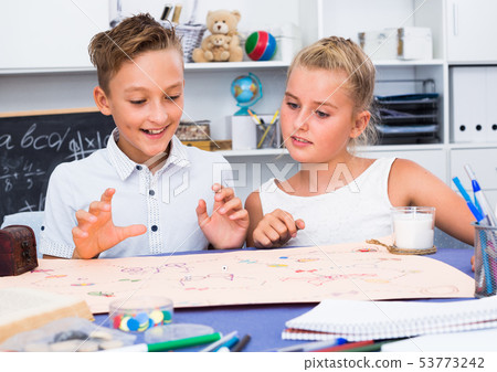 Boy with sister are playing in game 53773242