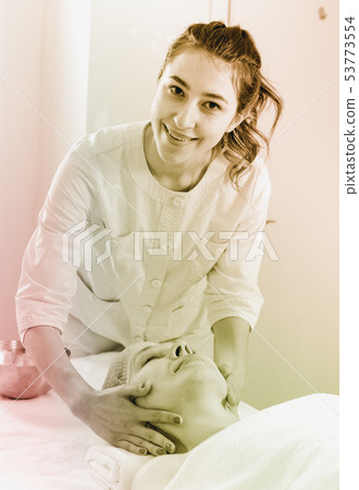 Mature woman having face massage Mature woman having face massage 53773554