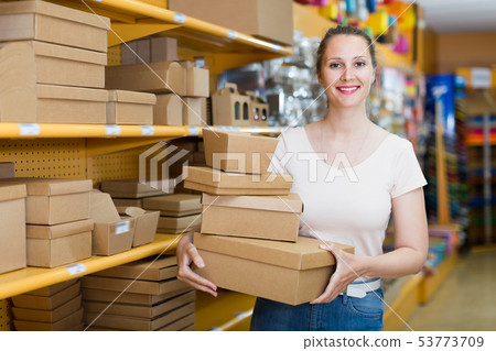 Laughing girl with gift boxes 53773709