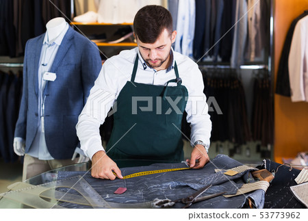 Male tailor working at workshop 53773962