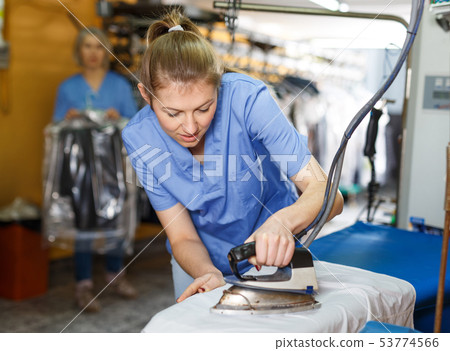 In process of ironing clean clothes In process of ironing clean clothes 53774566