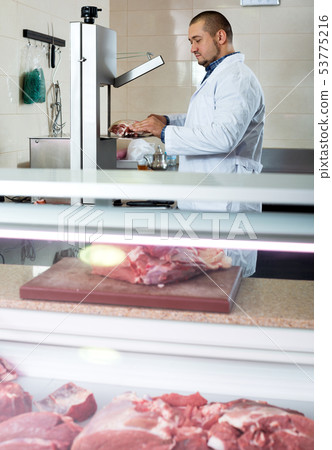 Male butcher in kosher section at supermarket Male butcher in kosher section at supermarket 53775216