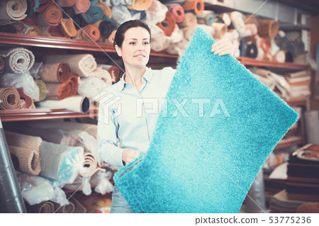 woman consumer holding carpet 53775236