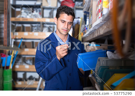 master is checking small details in boxes master is checking small details in boxes 53775290