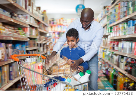 Lucky African American man and son in store 53775438