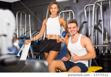 man taking break during workout in gym indoors man taking break during workout in gym indoors 53775512