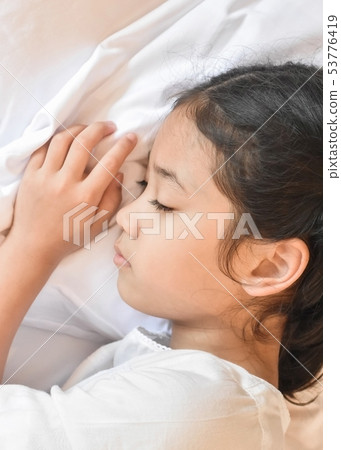 Sleeping well concept with students tight asleep Sleeping well concept with students tight asleep 53776419